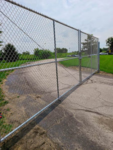 Cedar Rapids fencing company commercial fence contractor Iowa double single cantilever roller slide vertical lift vertical pivot ornamental picket decorative chain link security commercial industrial correctional prison manufacturing hinges hardware swing drive way estate perimeter