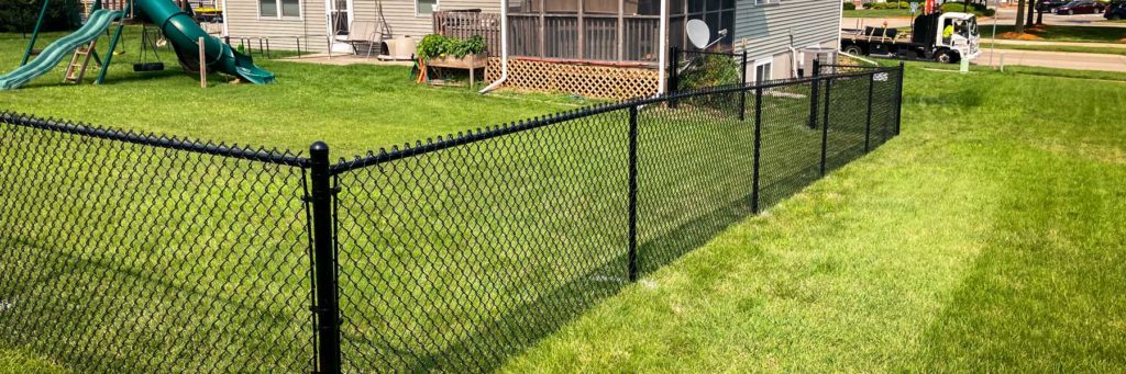 Cedar Rapids fence company chain link fence residential fencing contractors Iowa playground chain link gate posts tubing pipe top rail chain link fabric wire mesh galvanized aluminum vinyl coated black brown green 9 gauge fence fencing security perimeter hinges installation repair costs panels hardware fittings