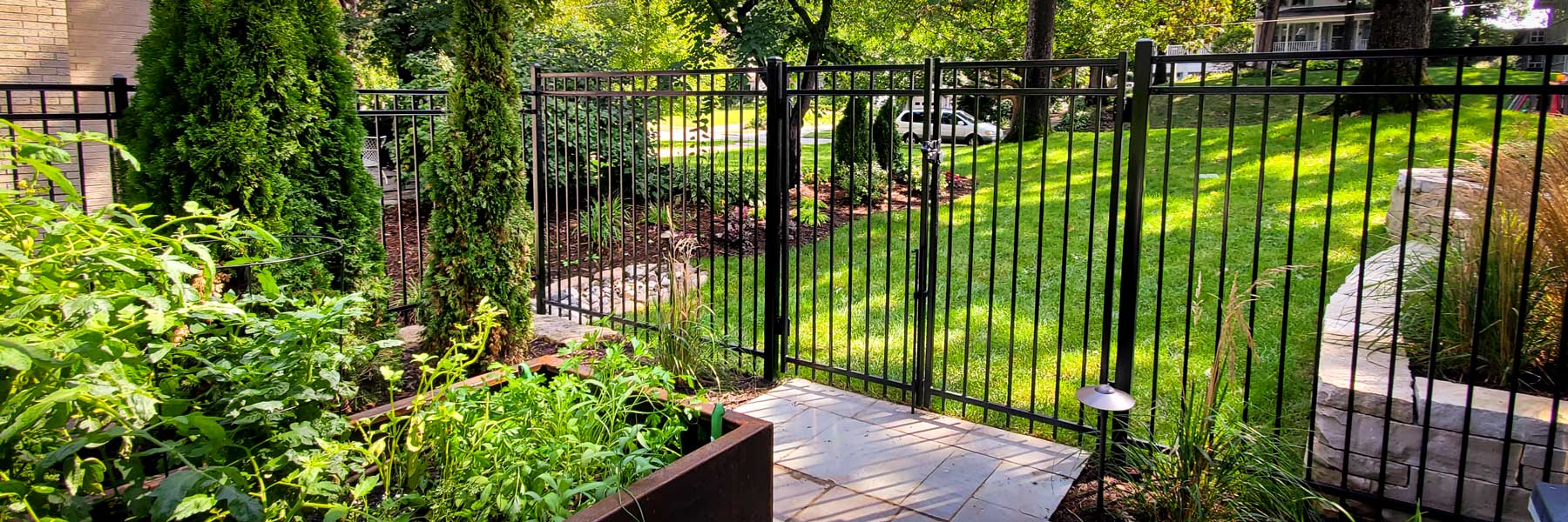 Cedar Rapids fencing company residential fence contractors Iowa ornamental custom metals decorative rail picket posts powder coating security quad flare spear flat top fleur de'lis iron steel aluminum commercial industrial classic warrior panels posts caps rails prices